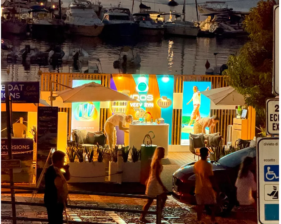 Illuminated waterfront brand activation at night